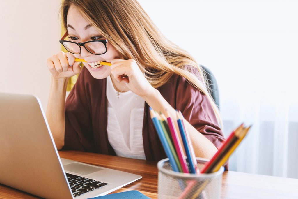 An image of a woman at a laptop concentrating.