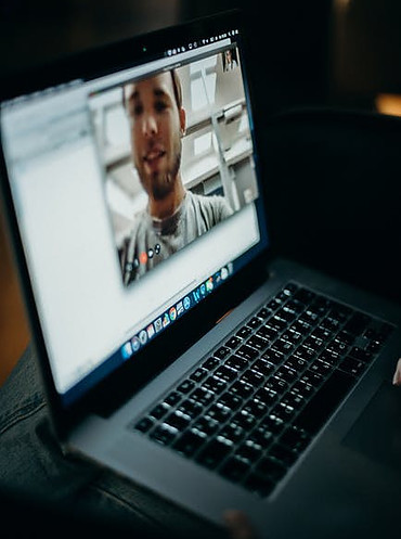 Image of a notebook with someone skyping